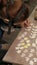 Female ceramist paints a clay product.. Vertical video