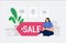 Female character shopping online in home and sits on a discount tag. Big discount, gifts and purchases, sales and online