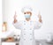 Female chef in face mask showing thumbs up