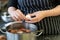 Female chef hands peeling hardboiled eggs in the kitchen