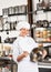 Female Chef Mixing Egg With Wire Whisk In Bowl