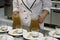 Female chef prepares plates of appetizers in a restaurant kitchen