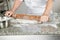 Female Chef Rolling Dough In Kitchen