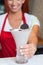 Female chef serving milk shake