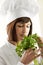 Female Chef Smelling Parsley