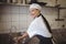 Female chef washing hands in the commercial kitchen