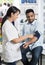 Female Chemist Checking Blood Pressure Of Patient