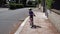 Female child covid safety is biking on the road  FDV