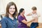 Female children`s doctor in front of pediatrician little boy examination