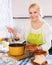 Female chopping cabbage for soup