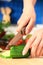 Female chopping food ingredients.