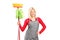 Female cleaner holding a mop and a broom