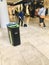 A female cleaner sweeps the floor in the mall.