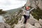 Female climber at the top of the route