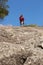 Female climber walking on mountain