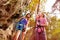 Female climbers standing at the foot of a mountain