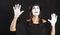 Female Clown Mime Looks Up in White Face