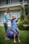 Female coach assisting senior woman in performing exercise