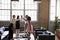 Female colleagues high five at a motivational meeting