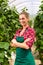 Female commercial gardener in green house