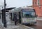 Female commuter gets ready to board public transit bus