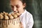 Female confectioner eating whole cake