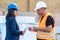 Female construction boss talking to a foreman