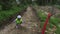 Female construction engineer measuring trench