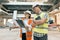 Female construction inspector examining construction site. Building, development, teamwork and people concept