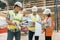 Female construction inspector examining construction site. Building, development, teamwork and people concept