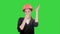 Female construction worker in helmet making funny dancing on a Green Screen, Chroma Key