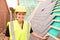 Female Construction Worker On Site Laying Slate Tiles