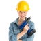 Female Construction Worker Wearing Helmet While Holding Drill