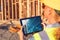 Female Construction Workers Reviewing Building on Computer Pad