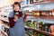 female consumer choosing tomato paste