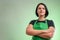 Female cook with green apron and black t-shirt confident hero-shot
