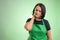 Female cook with green apron and black t-shirt has sore throat