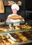 female cooks demonstrating and selling to the customer pastry