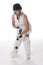 Female cricketer in a white dress with bat, pads, bat and safety helmet.