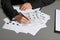 Female criminalist filling fingerprints card at table