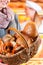 Female customer with breadbasket in bakery