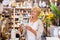 Female customer buying indian souvenir statue