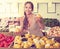 Female customer buying lemons on fruit market