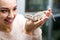 Female customer watching brown gecko