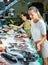 Female customers choosing seafoods at store