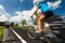 Female cyclist biking on a country road