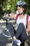 female cyclist looking at wrist watch