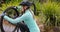 Female cyclist repairing bicycle tyre