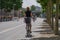 Female cyclist ride bicycle on bicycle lane.