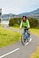 Female cyclist on s bend of cycle path